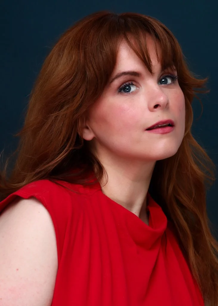 Blaire Erskine headshot, laughing.
